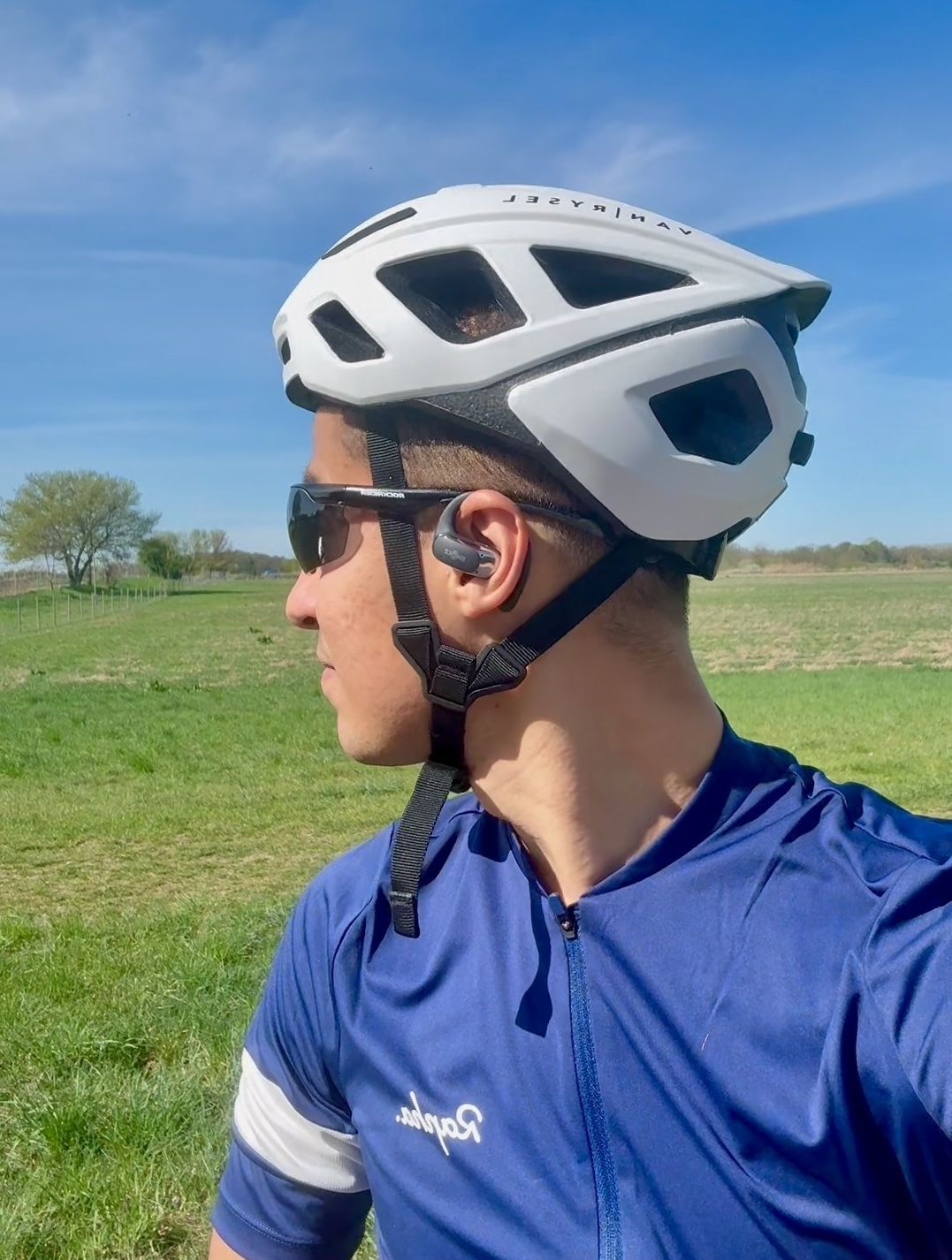 Portrait photo of Kareem outdoors with a bicycle.